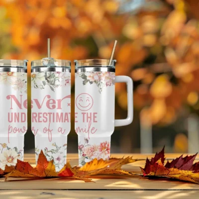 Never underestimate the power of a smile 40oz Travel Mug With Handle and Straw
