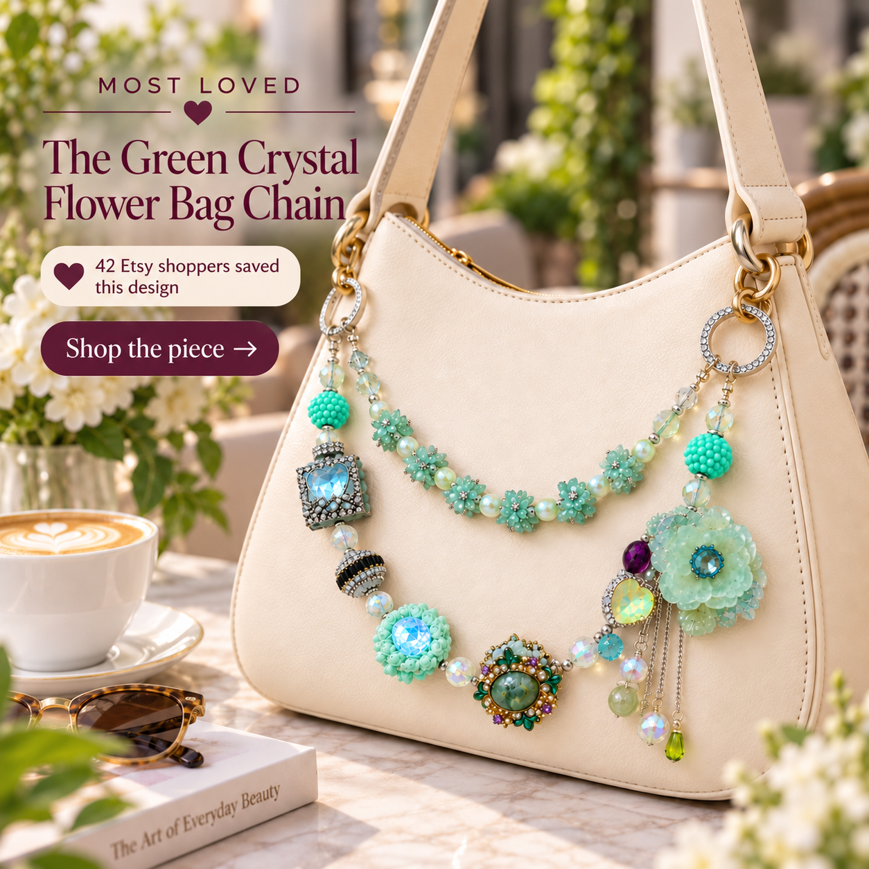 Green Crystal Flower Bag Chain attached to a cream handbag